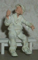 Just Plain Folk Figures Boy Sitting Holding a Balloon