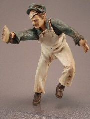 Just Plain Folk Figures Painter - Reaching to paint on a ladder